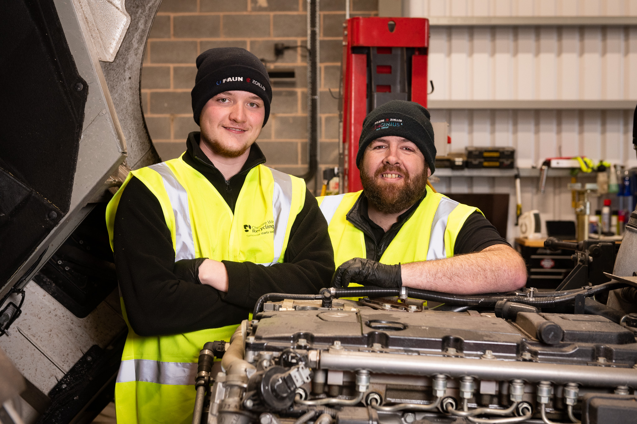 Jamie and Connor smiling in the workshop