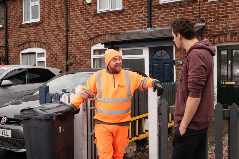 A resident talks to a loader